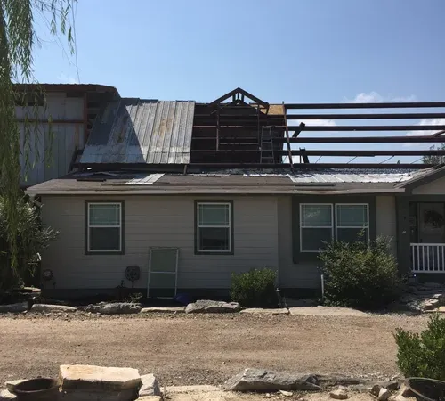 Covered porch roof extension under construction